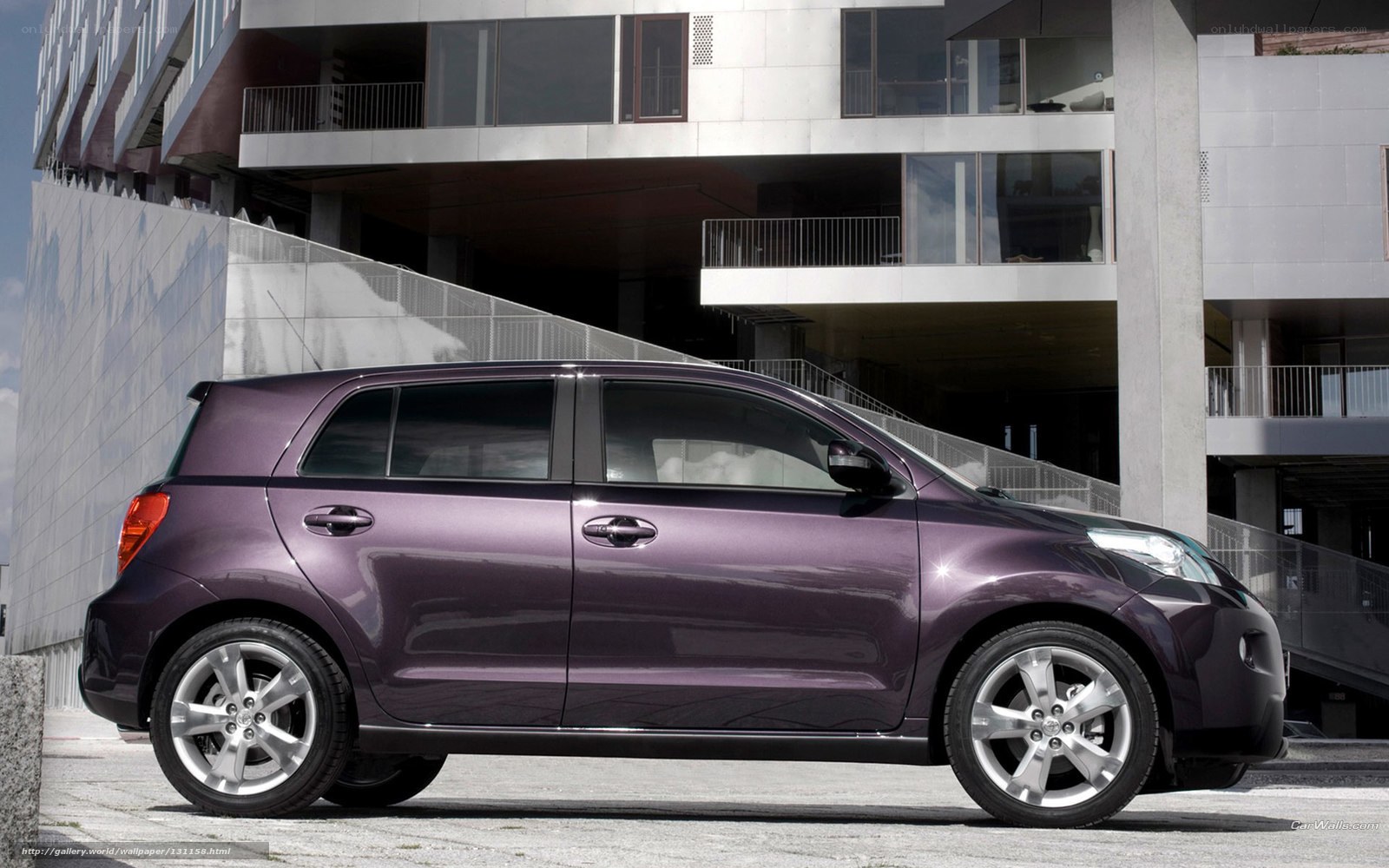 purple compact car in urban setting