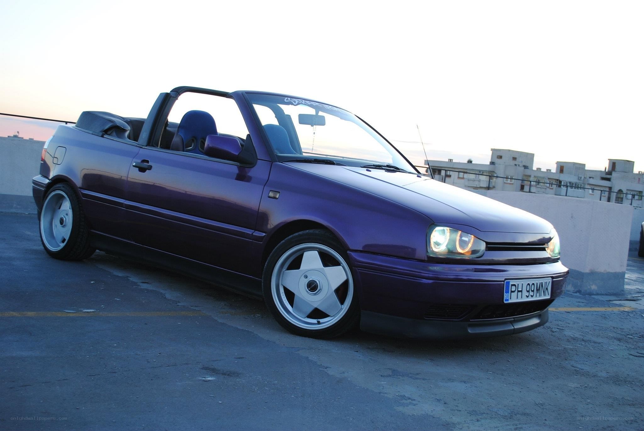 purple convertible car on rooftop