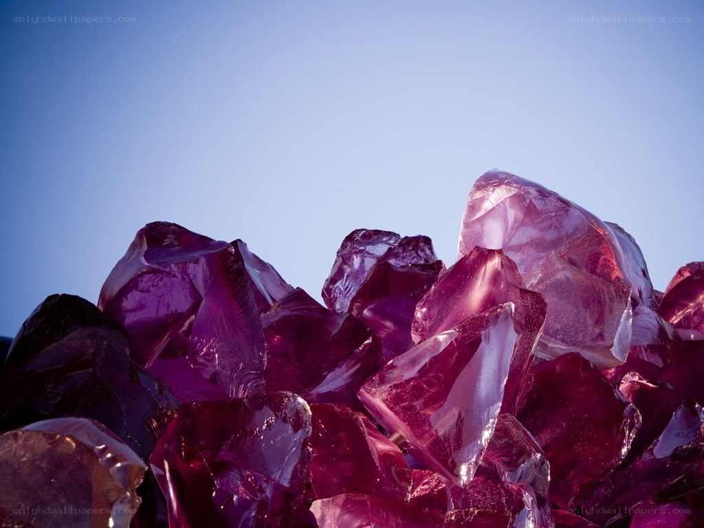 purple crystals against blue sky