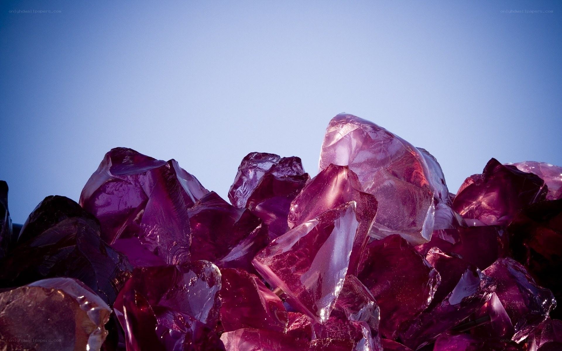 Purple crystals against blue sky
