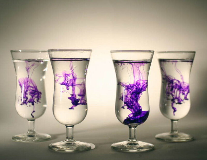 purple dye in water glasses