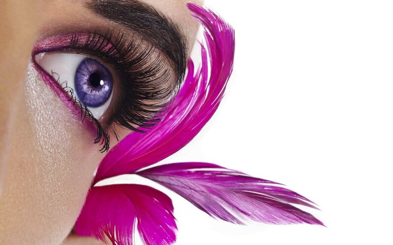 purple eye with feather