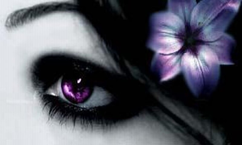 purple-eyed woman with flower