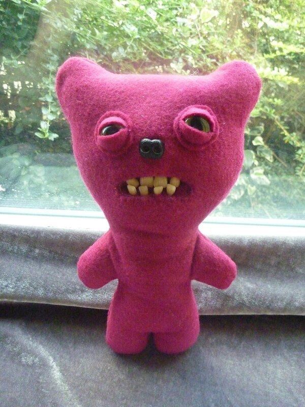 Purple felt monster toy