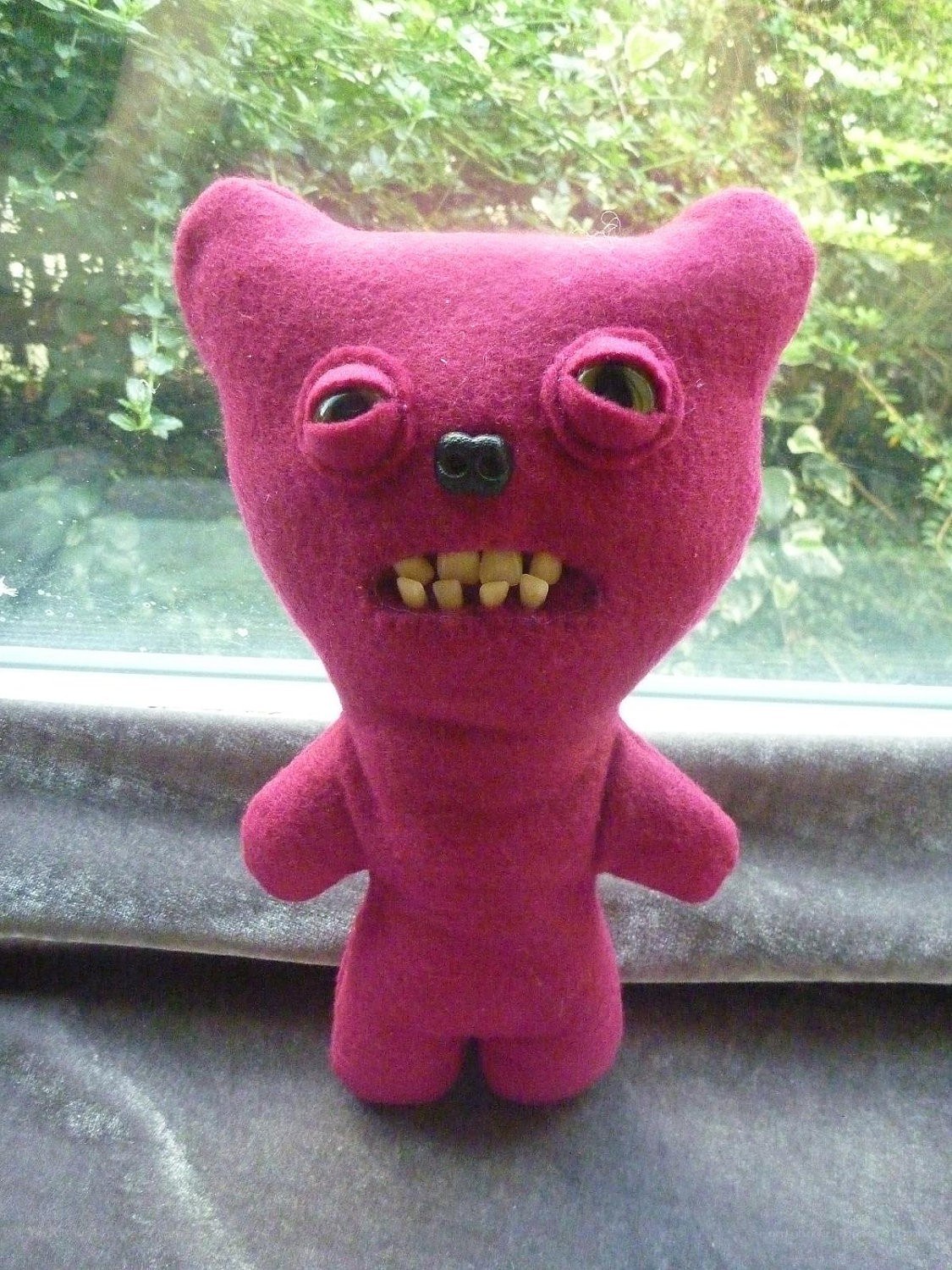 Purple felt monster toy