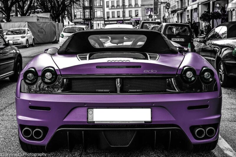 Purple Ferrari on city street