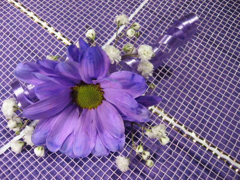 purple flower boutonniere