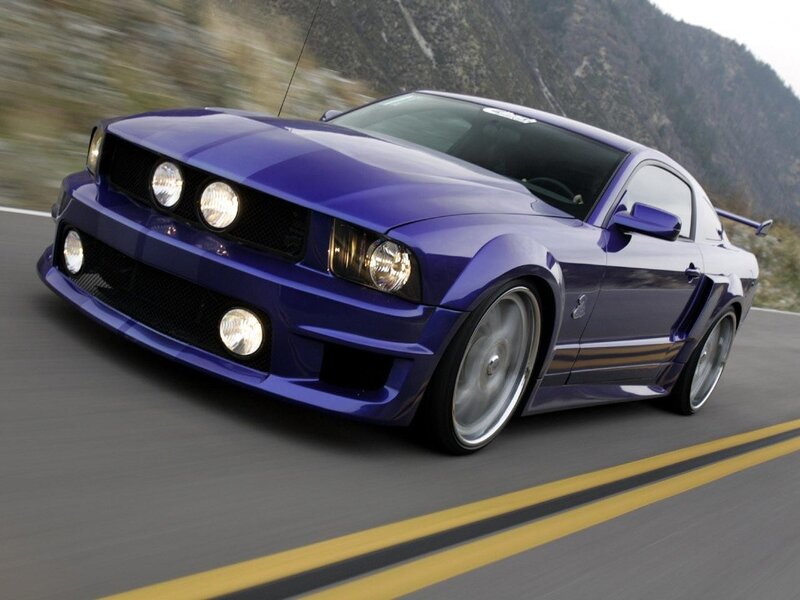 purple ford mustang on road