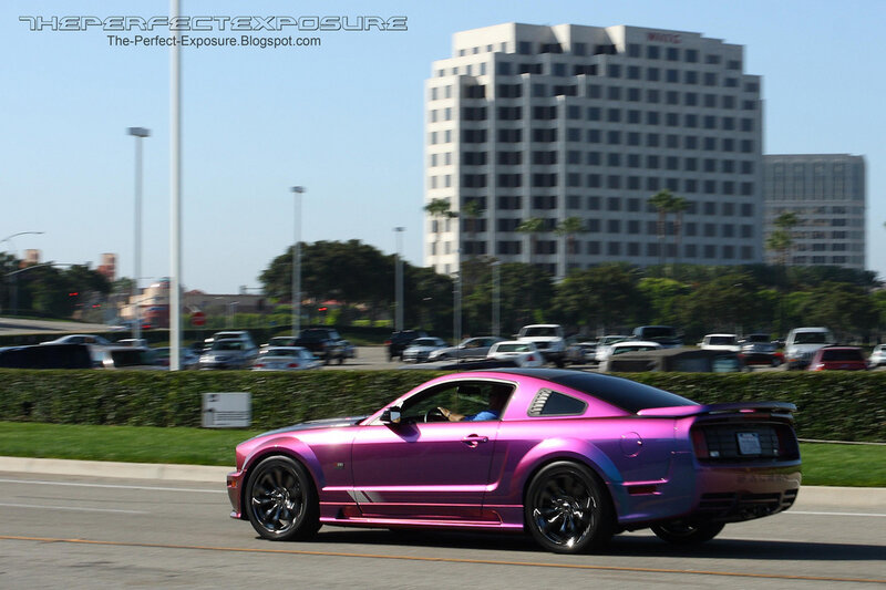 Purple Ford Mustang on the road