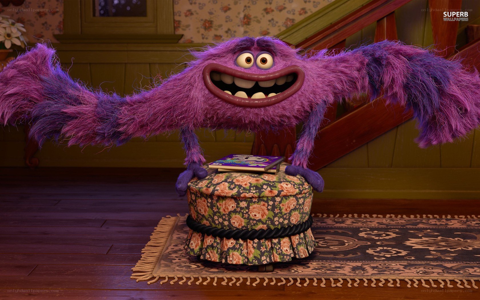 purple furry monster on ottoman