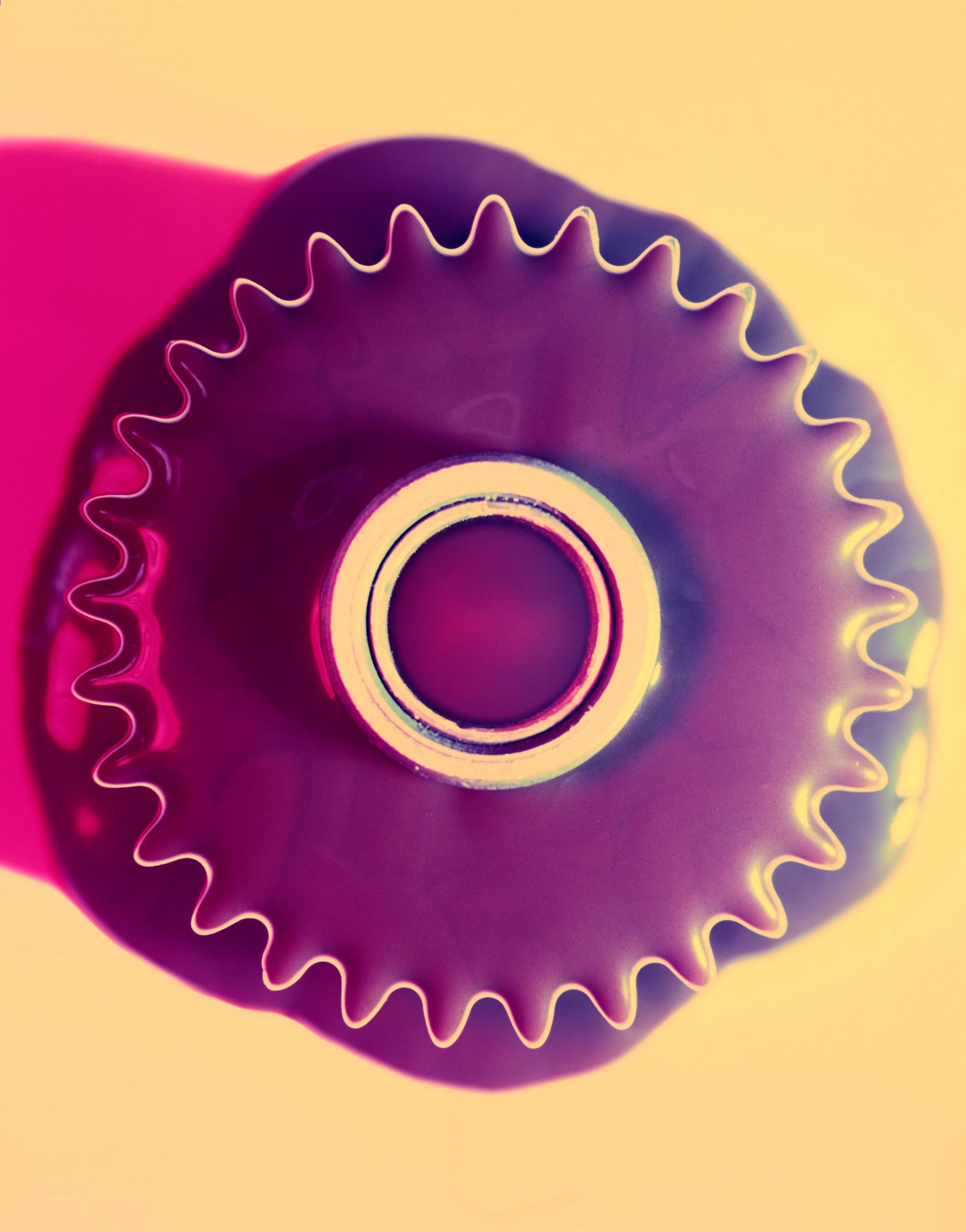 Purple gear-like object