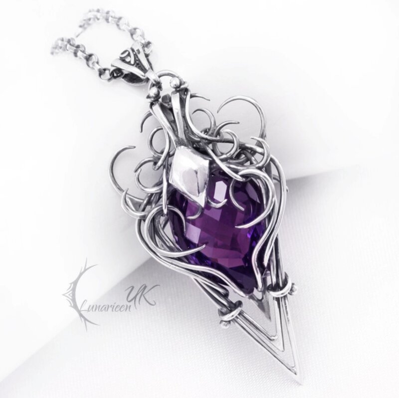 Purple Gemstone Pendant — Dramatic, Photograph