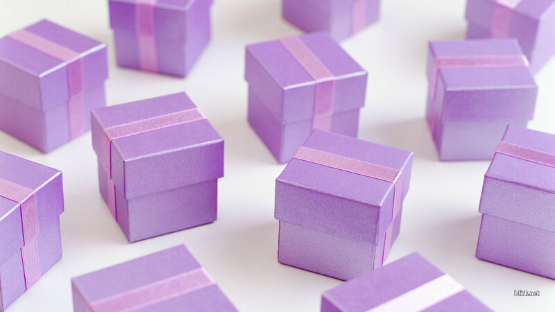 purple gift boxes with ribbons