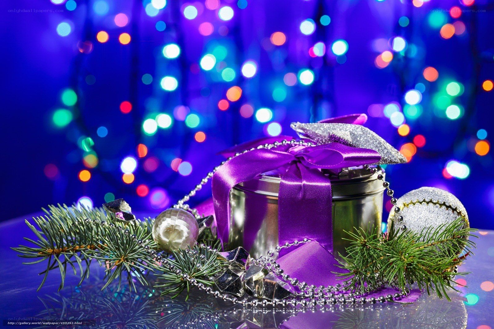 Purple gift with holiday lights