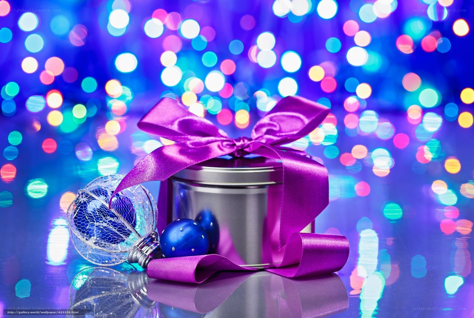 Purple gift with holiday ornaments