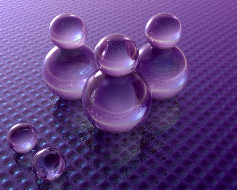 Purple glass spheres on textured surface