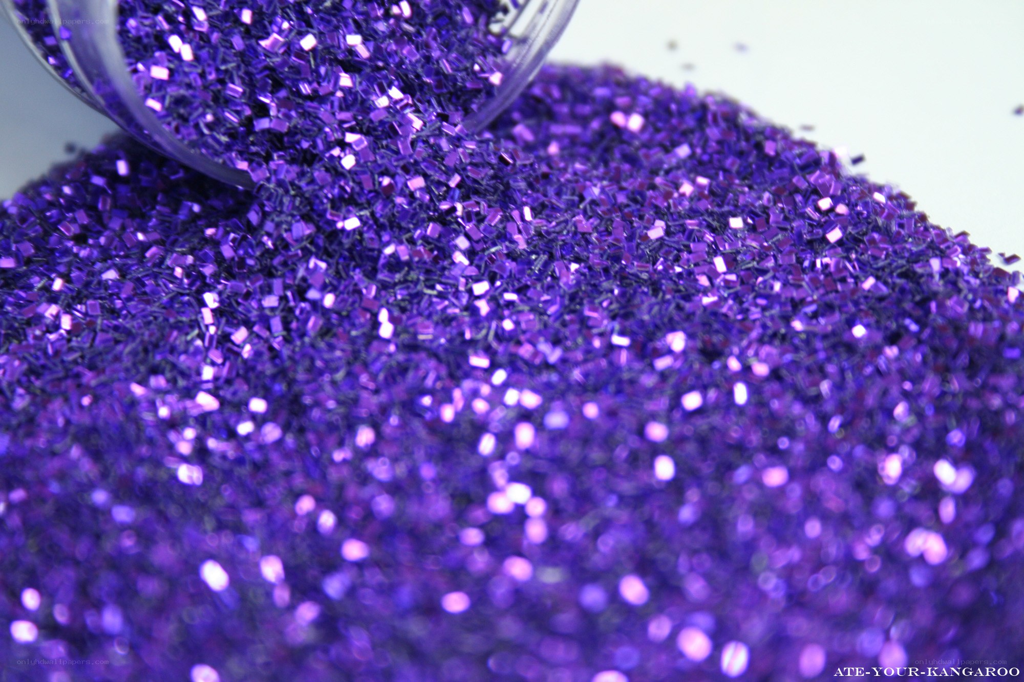 Purple glitter spilling from container