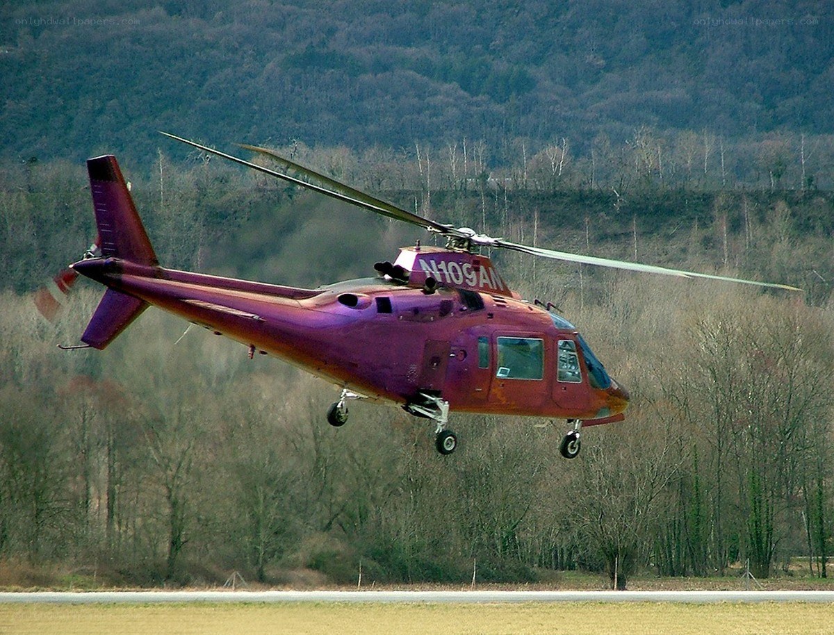 Purple helicopter in flight