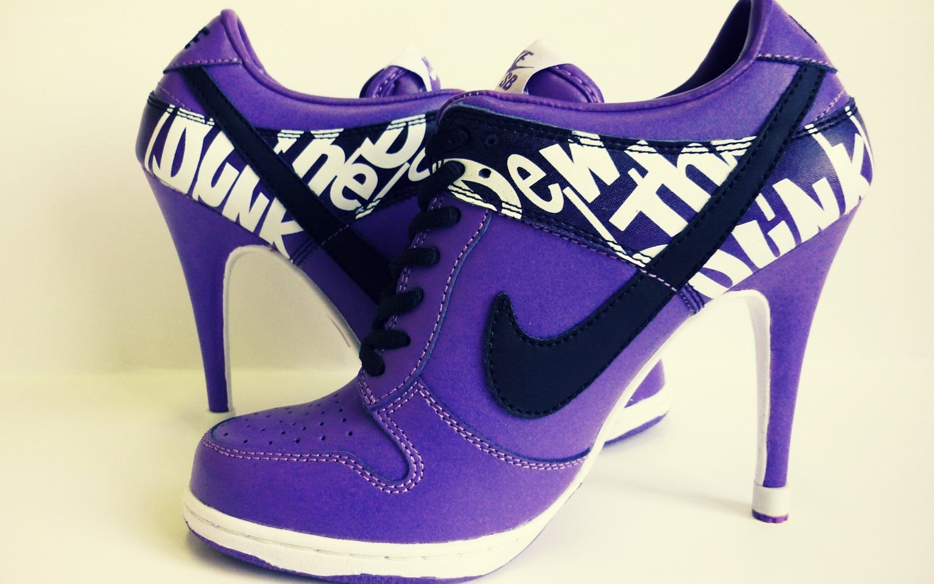 purple high-heeled sneakers