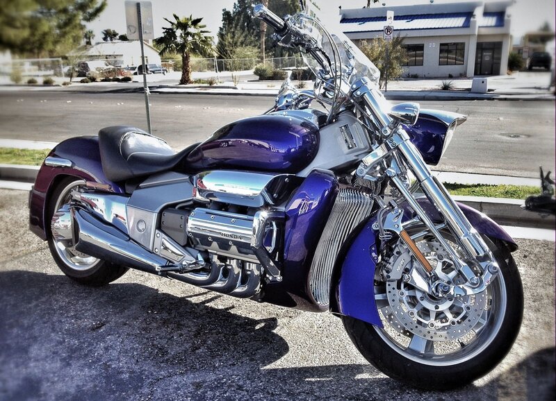Purple Honda motorcycle on street
