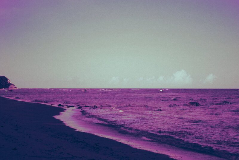 purple-hued beach scene