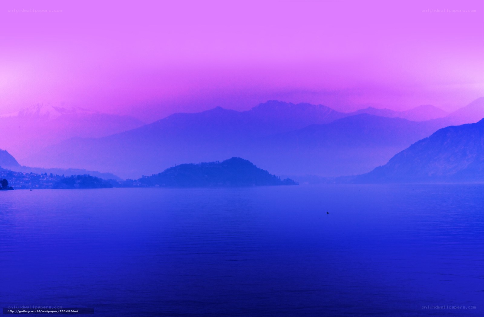Purple-hued lake and mountains