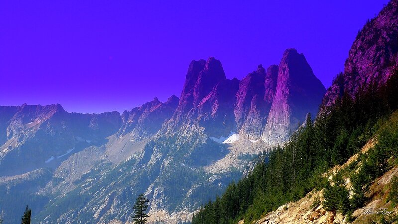 Purple-hued mountain peaks