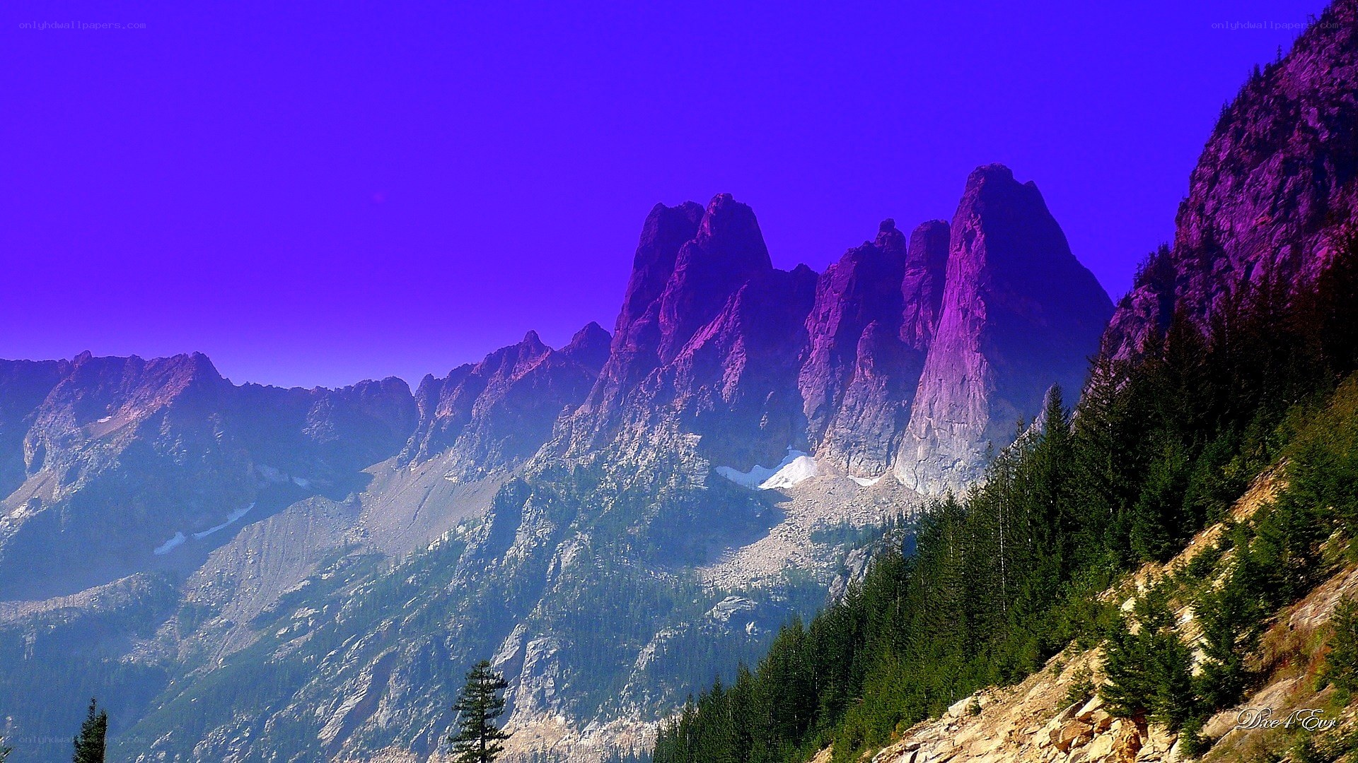 Purple-hued mountain peaks