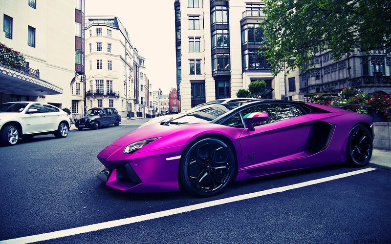 purple Lamborghini on city street