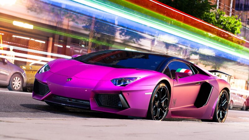 purple Lamborghini on city street