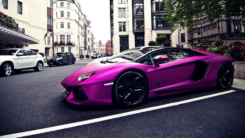 purple Lamborghini on city street