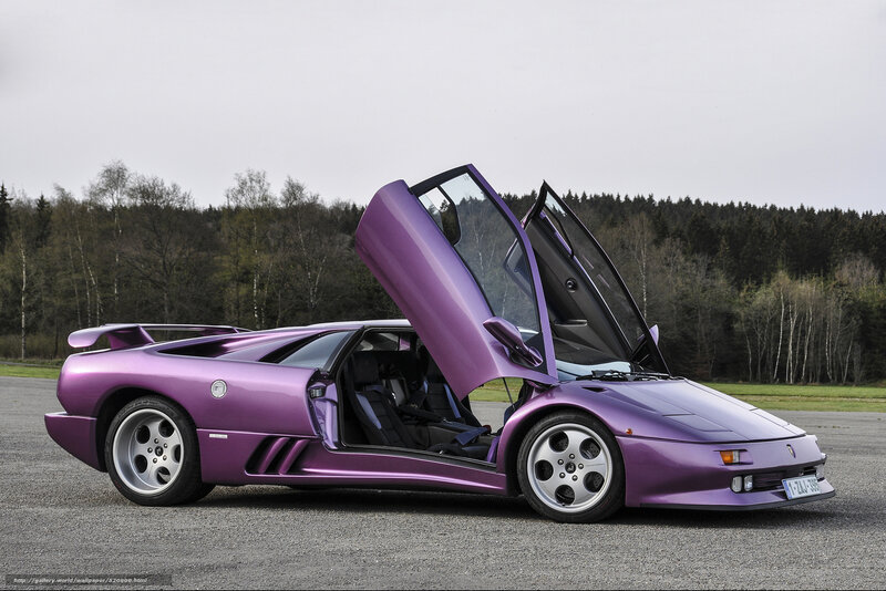 purple Lamborghini with doors open