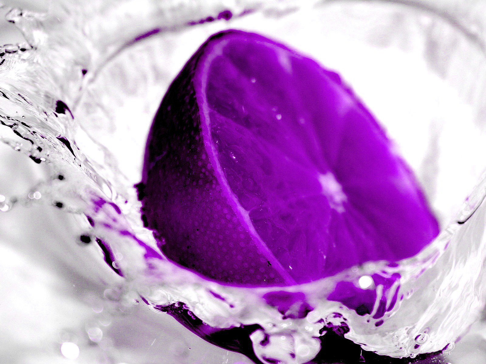 purple lemon in water splash