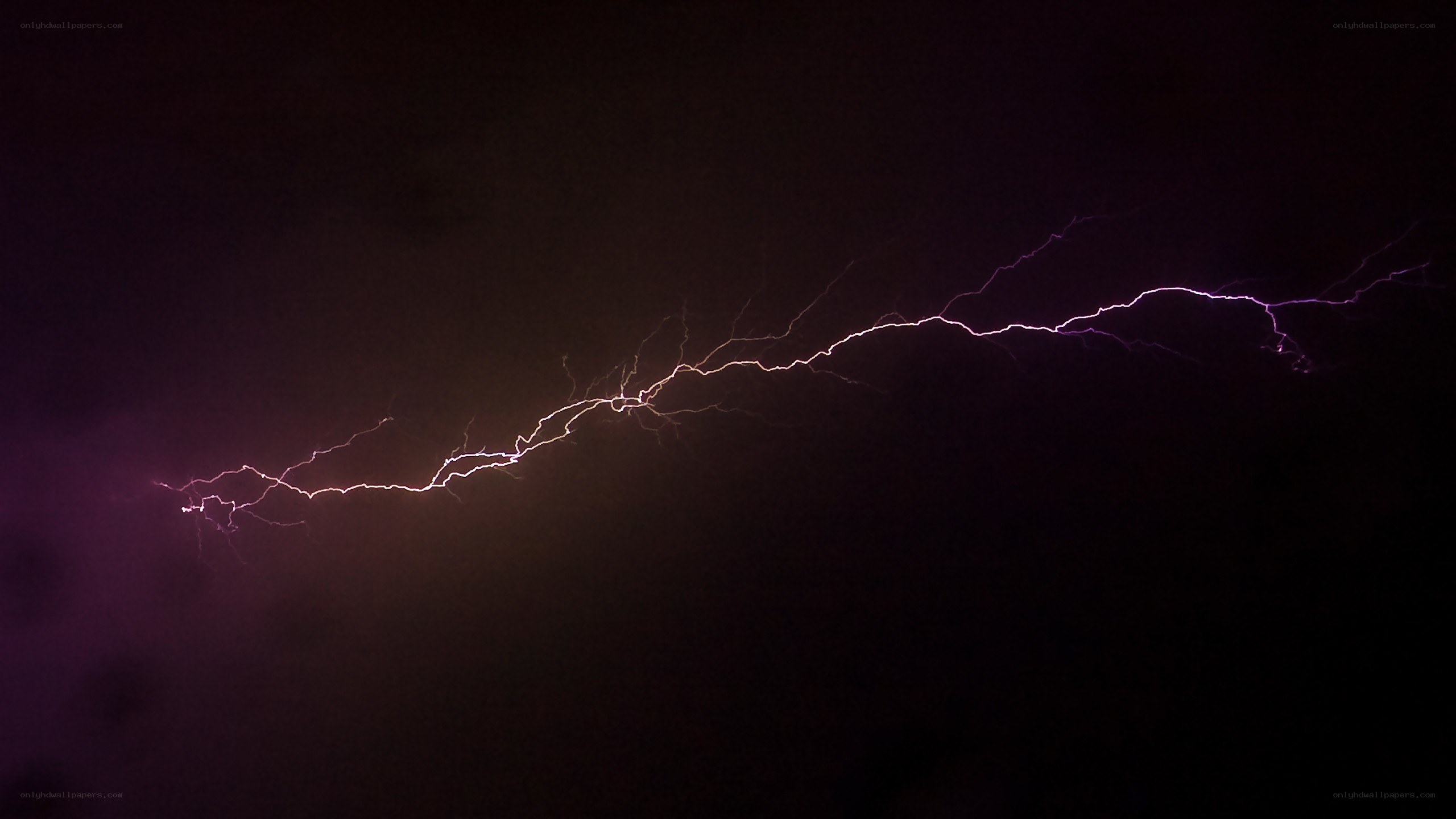 Purple lightning bolt in night sky