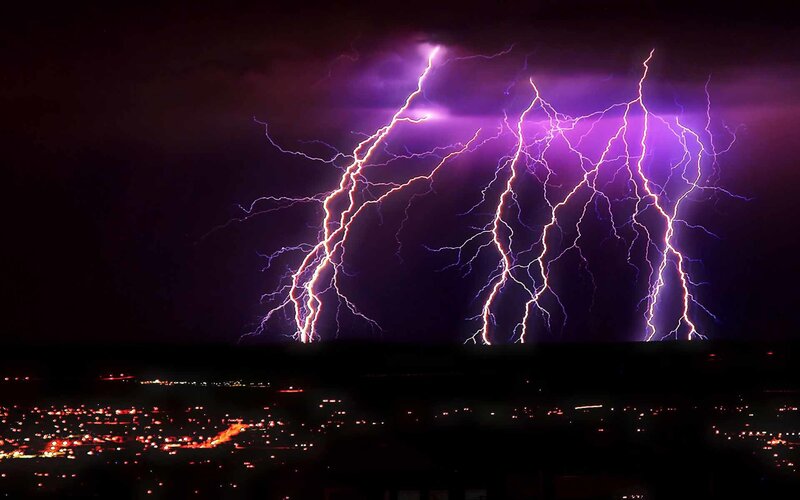 Purple lightning over city