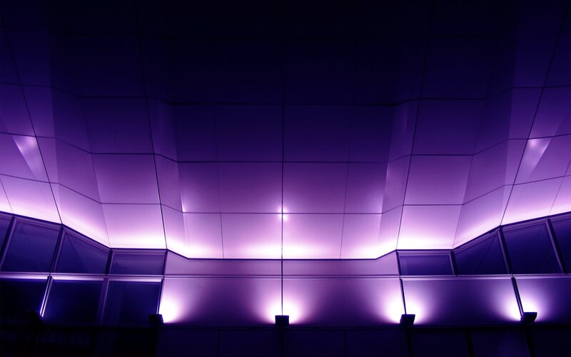 purple-lit architectural ceiling