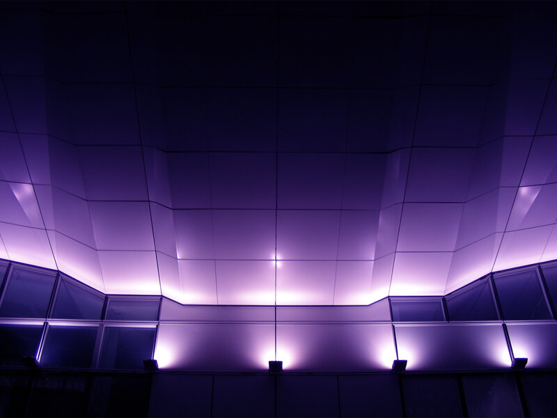 Purple-lit architectural ceiling