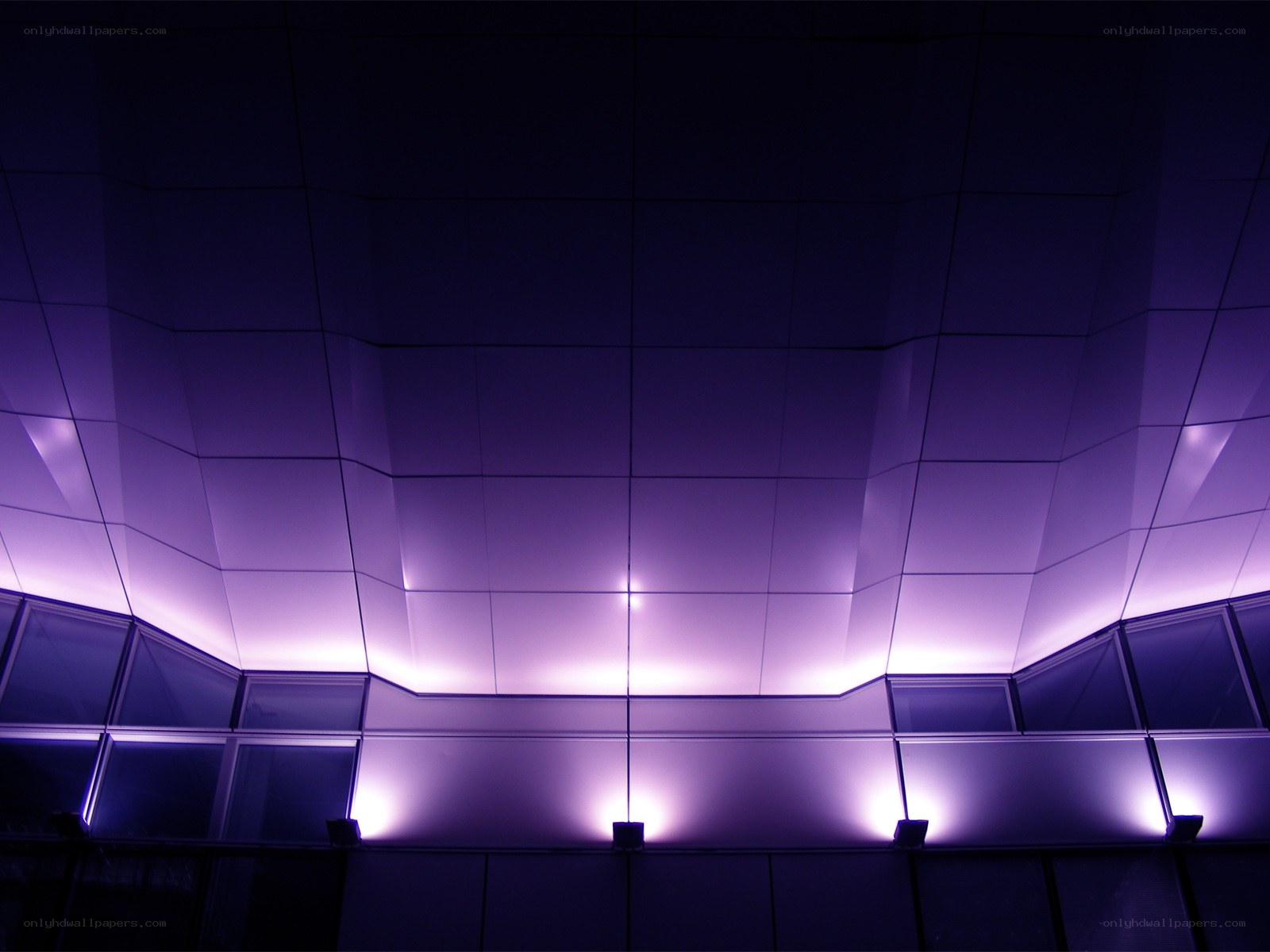 Purple-lit architectural ceiling