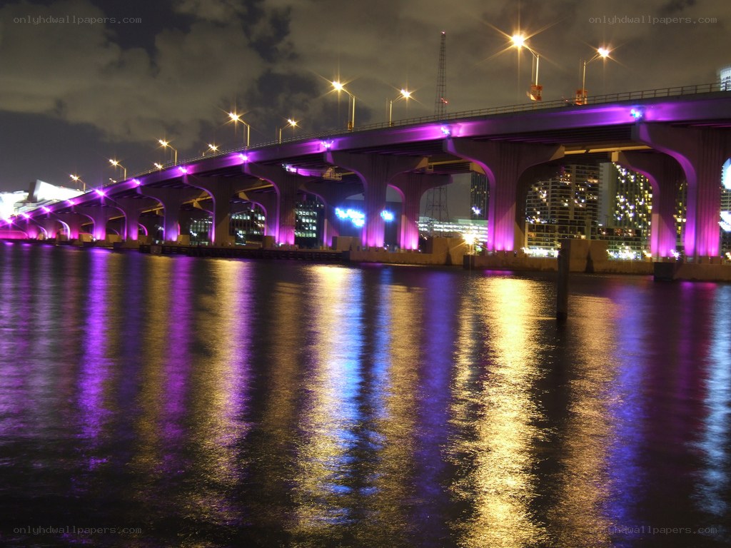 purple-lit bridge at night