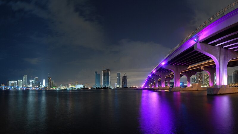 Purple-lit bridge at night