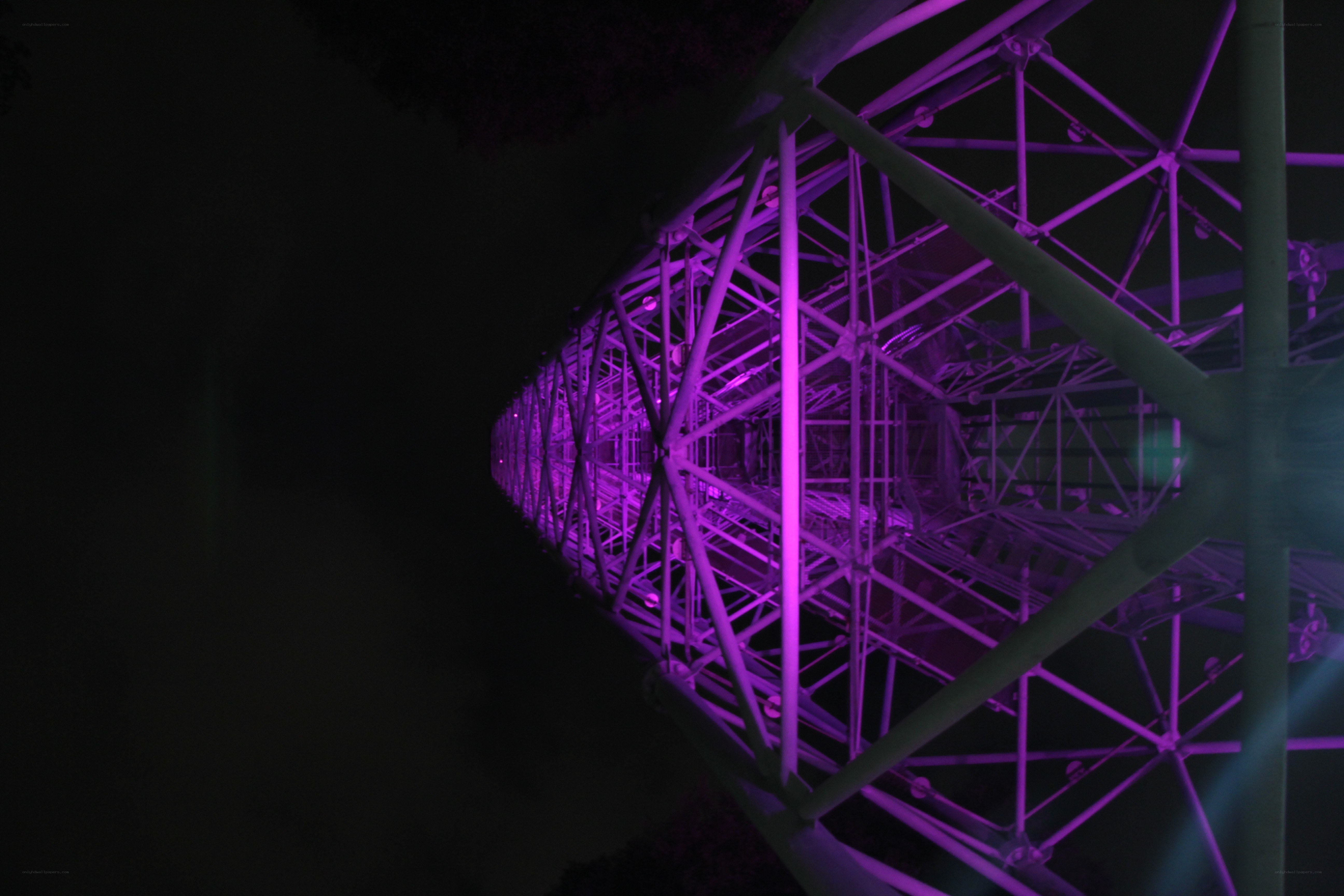 purple-lit bridge at night