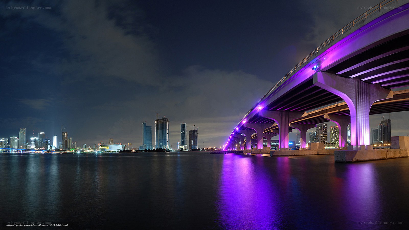 Purple-lit bridge at night