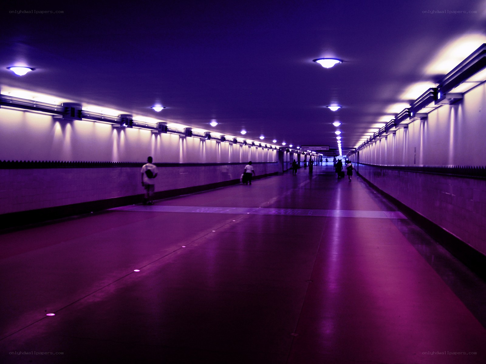 Purple-lit underground corridor
