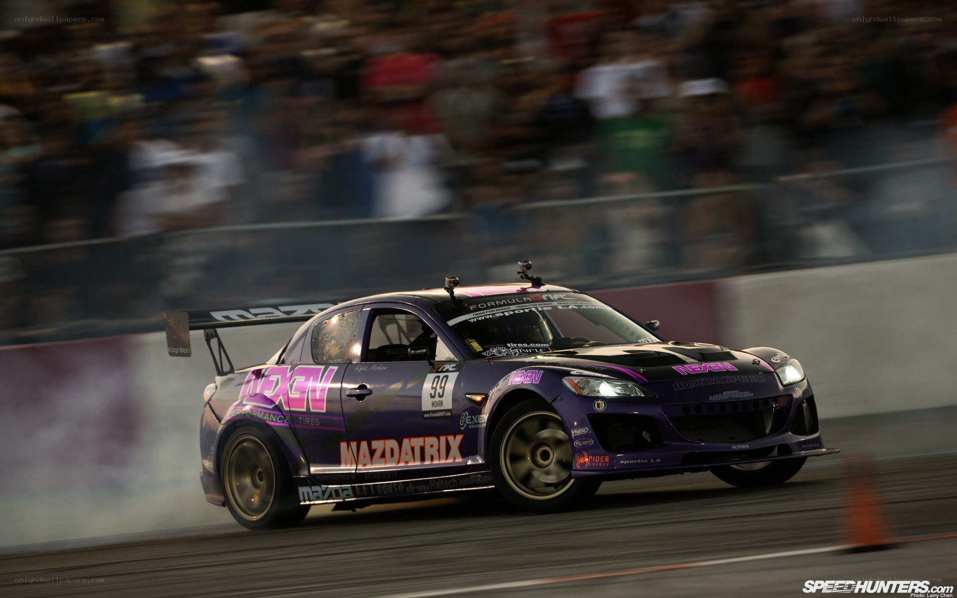 Purple Mazda racing on track