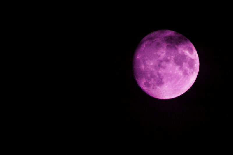 Purple moon in night sky
