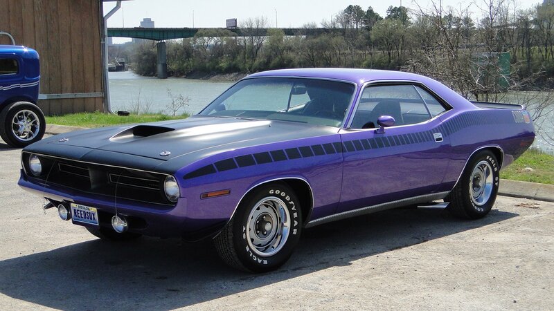 Purple muscle car by the river