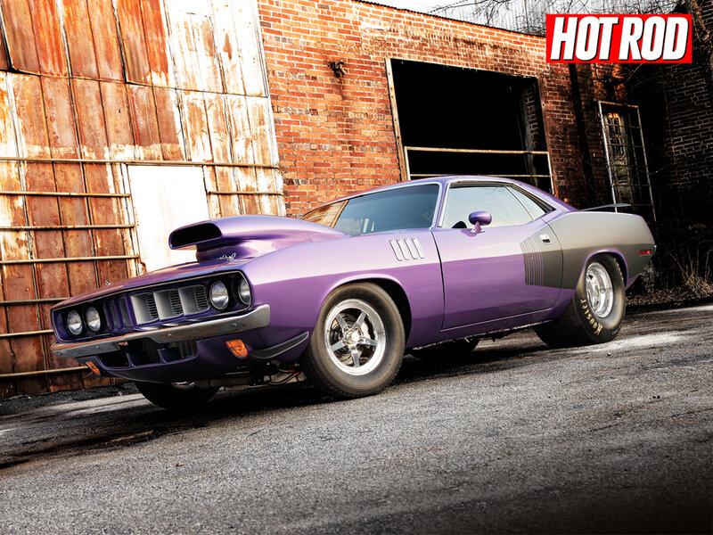Purple muscle car in industrial setting