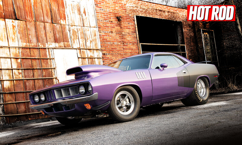 purple muscle car in industrial setting
