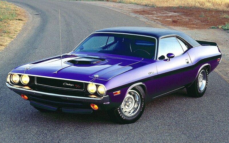 Purple muscle car on road