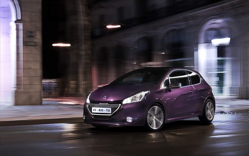 Purple Peugeot driving at night